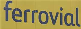 Blue Ferrovial logo against a yellow background