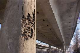 A damaged concrete bridge support