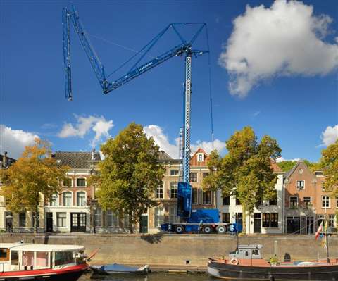 blue Spierings crane being set up in the Netherlands